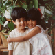 My favorite photo of Yush and me as kids, which captures the essence of our relationship.